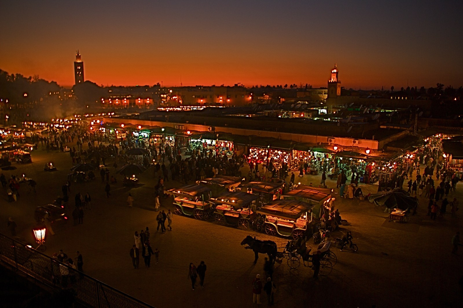 Marrakech at sunset seen over Jemaa el-Fna square with the minarets on the skyline